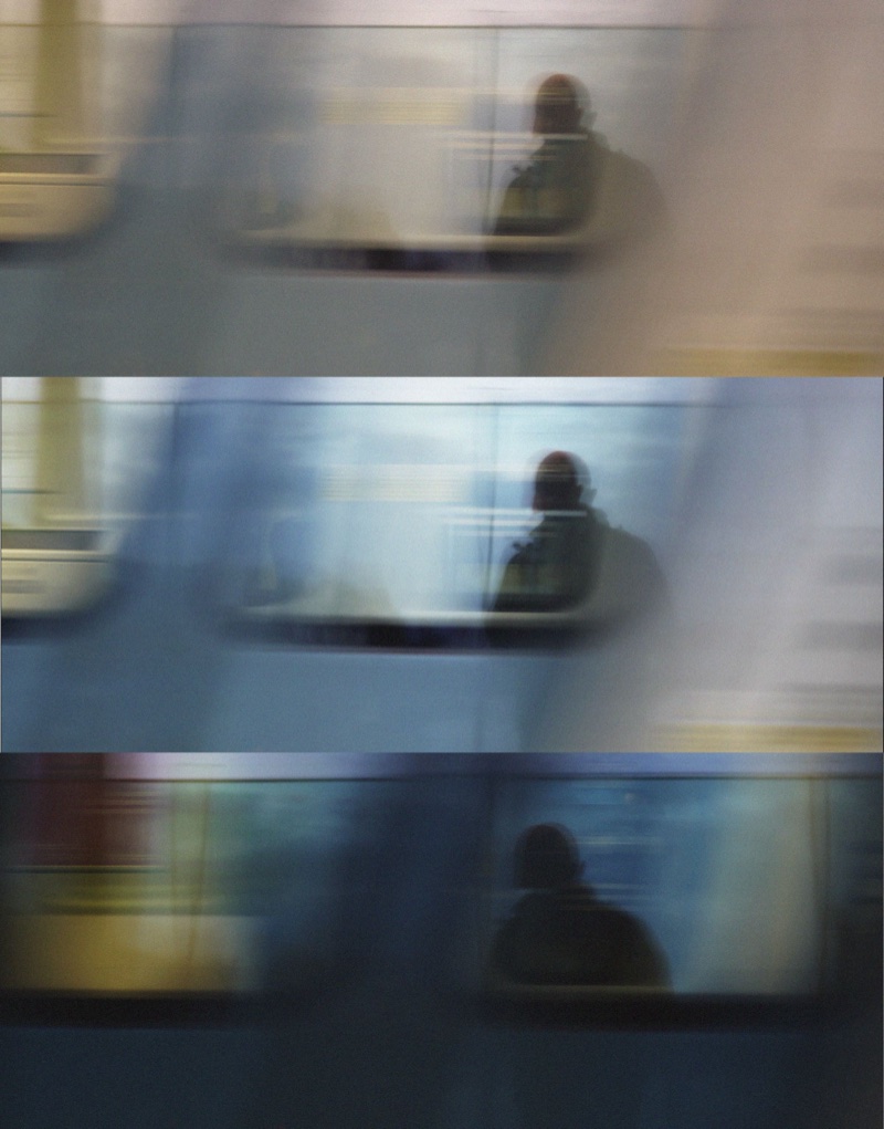 Blurred photo of a passenger on a moving train, shown in three color grades